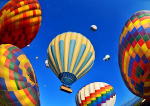 Colorful hot air balloons against blue sky at Cappadocia Turkey